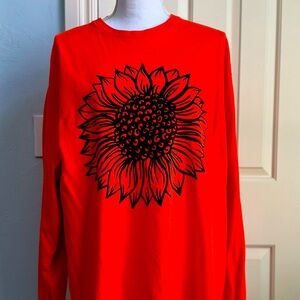 Delta Black Sunflower on an Orange Long Sleeve Tee